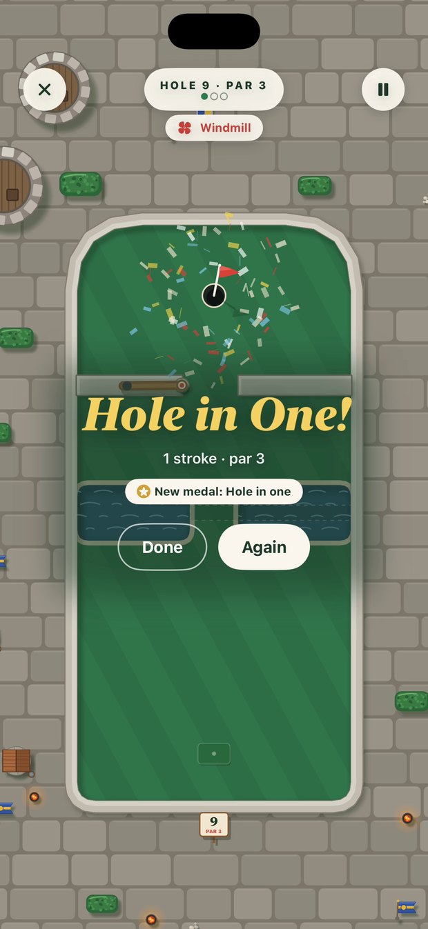 Greens Castle hole 9, Storm the Keep: confetti over the cup and a gold Hole in One! banner