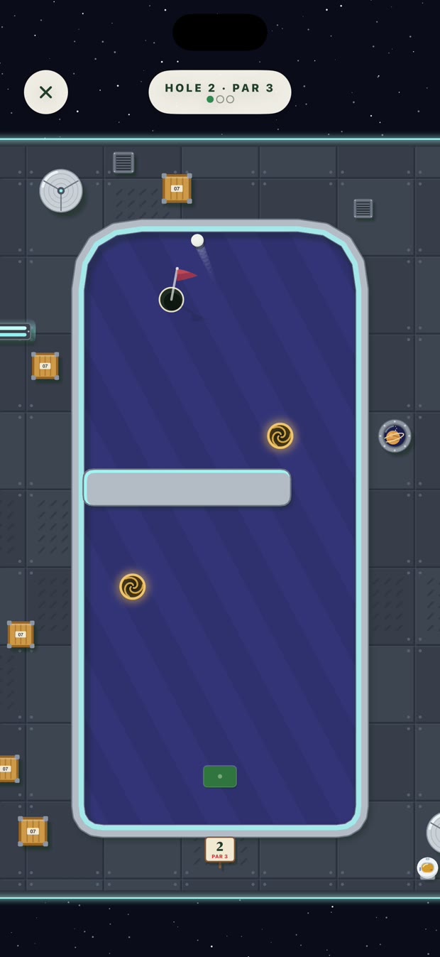 Greens Space Station course: the ball coming out of a wormhole near the cup on a purple hole